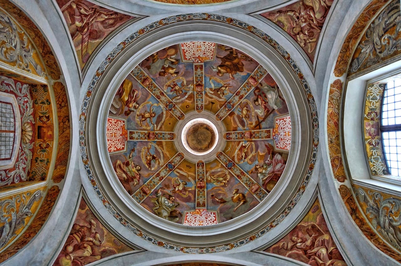 Photo of an intricate, vaulted church ceiling