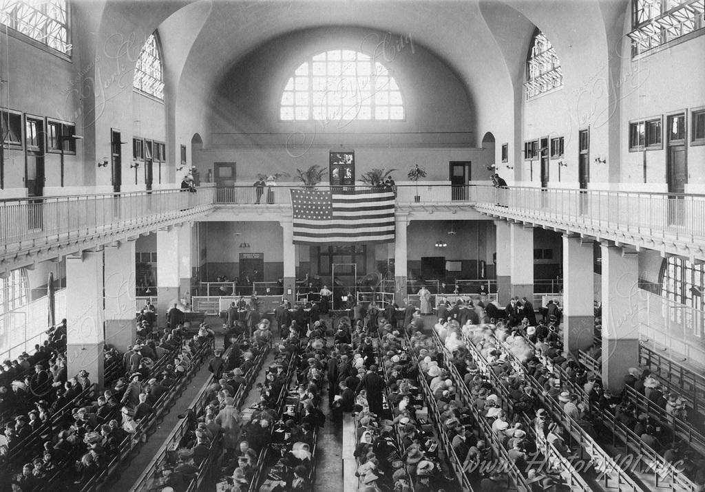 Explore the 1902 Main Hall at Ellis Island, capturing NYC's pivotal role in the immigrant journey and shaping its cultural diversity