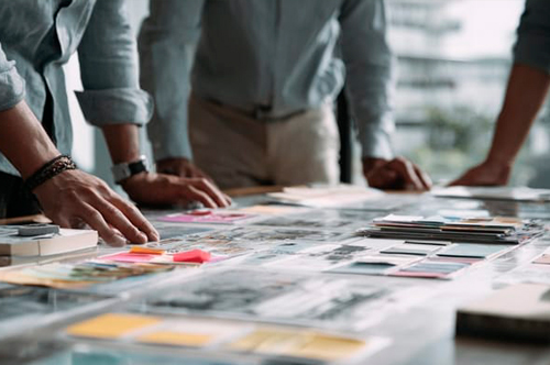 Photo of printing co-founders collaborating on a wallpaper project