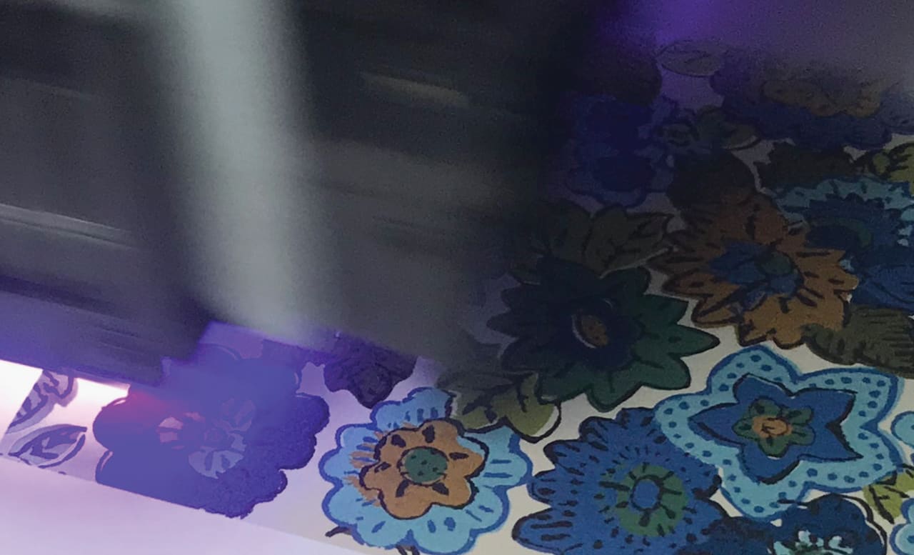 Close up of pattern being printed and lit by a UV lamp